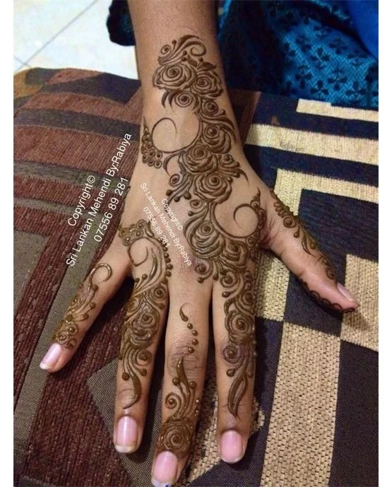 Trendy Touch Blending Into Leaf Back Hand Mehndi Design